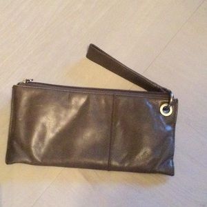 Vida wristlet with wanderlust lining.